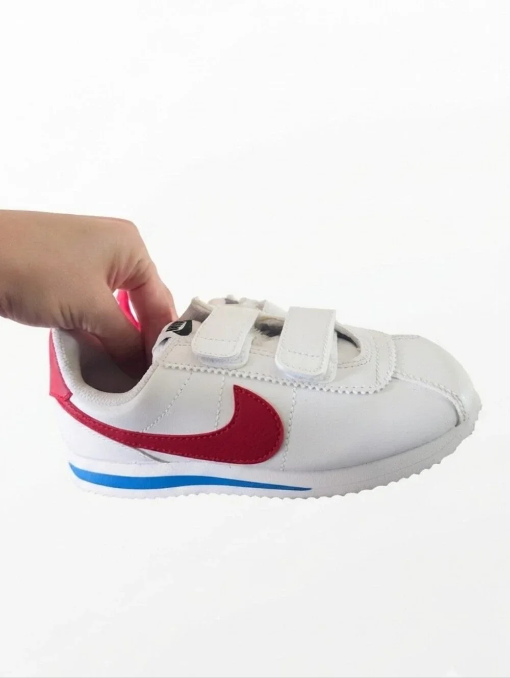 Nike Kids White Sneakers with Red Swoosh and Blue Accent